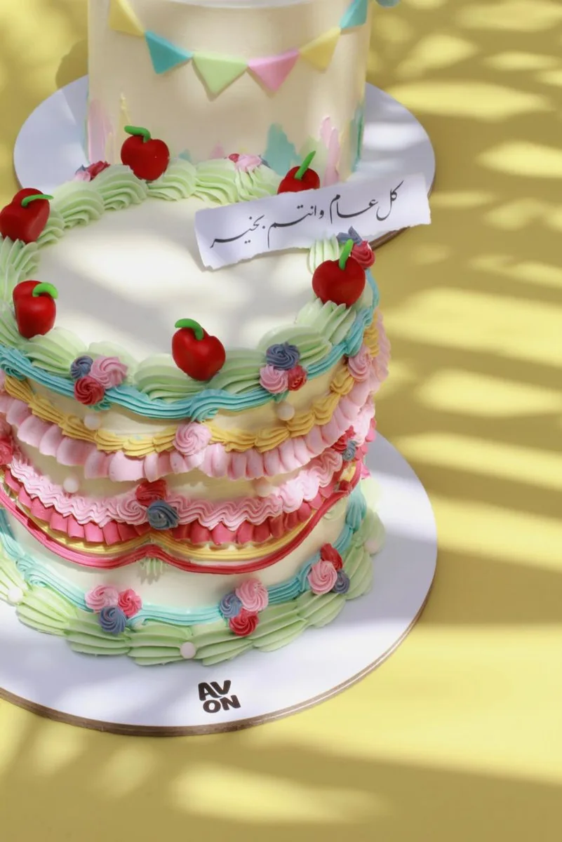 Double-height Fancy Nancy cake with a written topper on top
