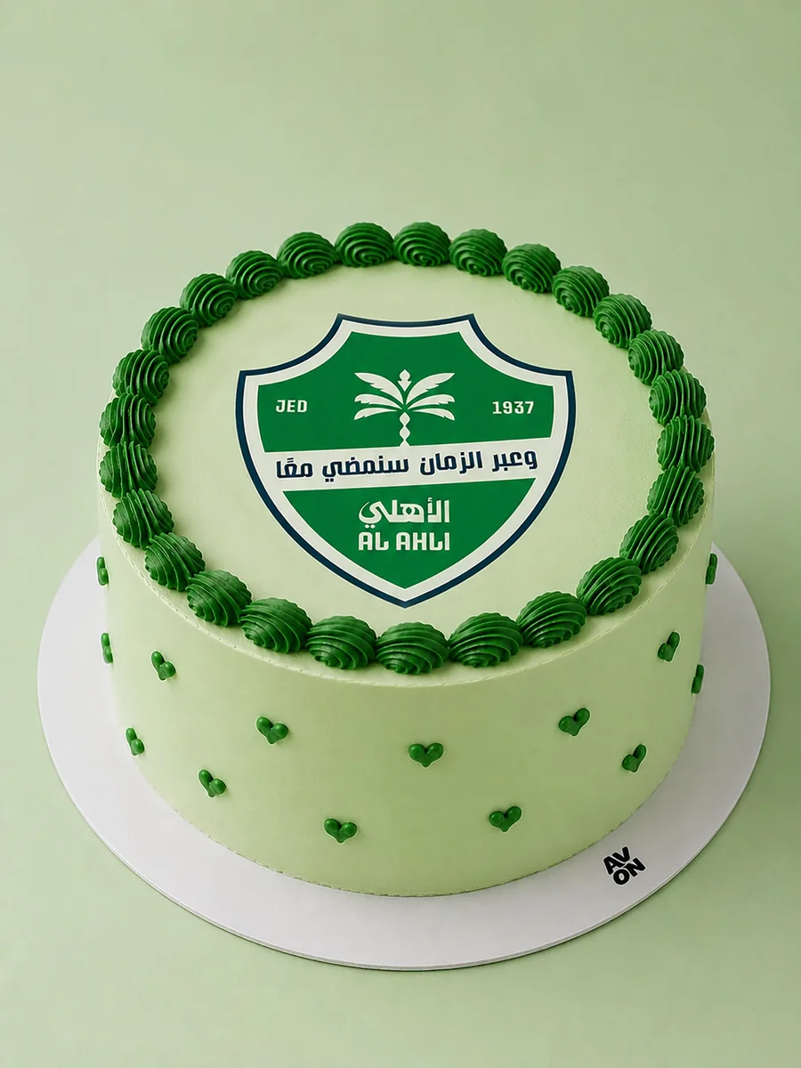 Al Ahli Champion cake with green cream and hearts by Avon Cake