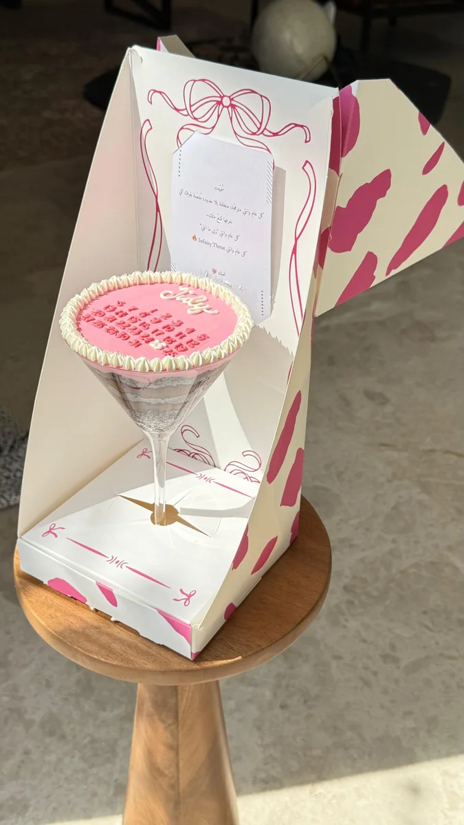 Martini cake in a glass with a mini calendar and a pink gift box by Avon Cake