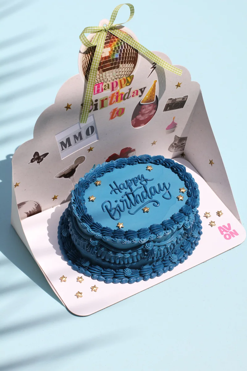 Royal Blue cake with a name and photo backdrop by Avon Cake
